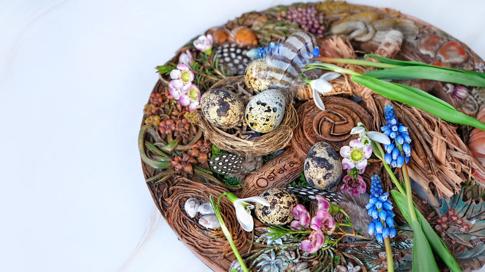 Decorative Ostara altar with nest, eggs, flowers, and feathers