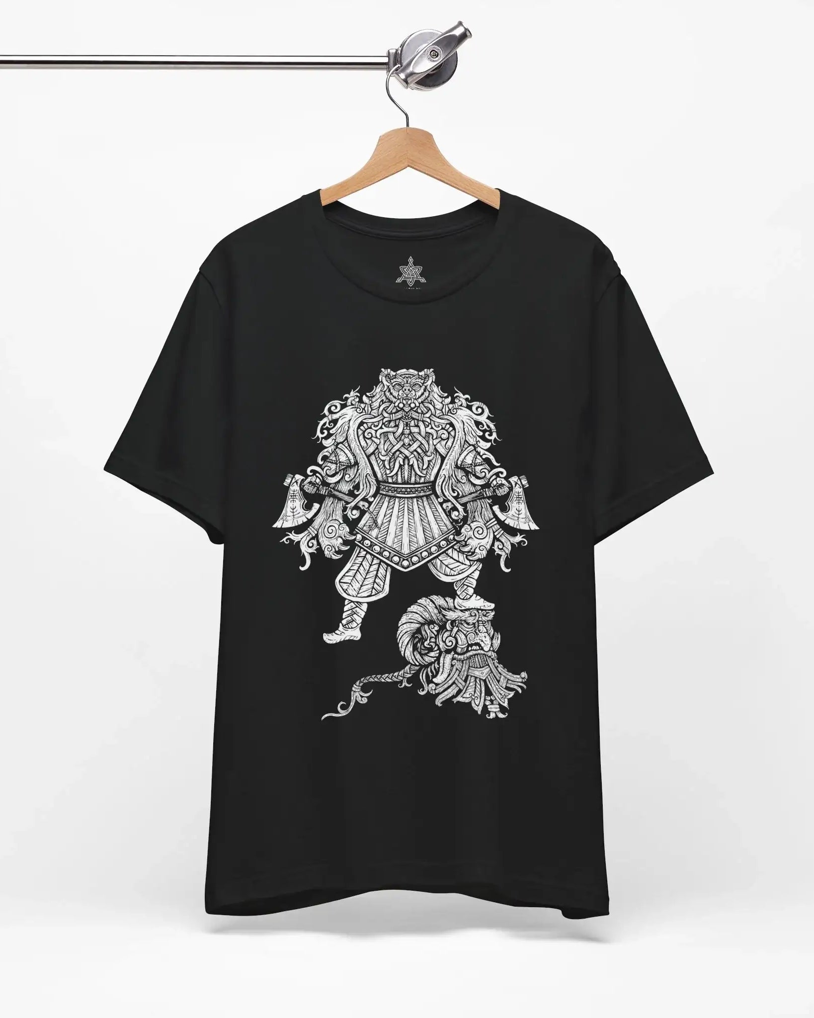 A black short-sleeve t-shirt hanging on a wooden hanger from a metal rail, featuring a large white graphic print of a detailed Viking Berserker on the front.