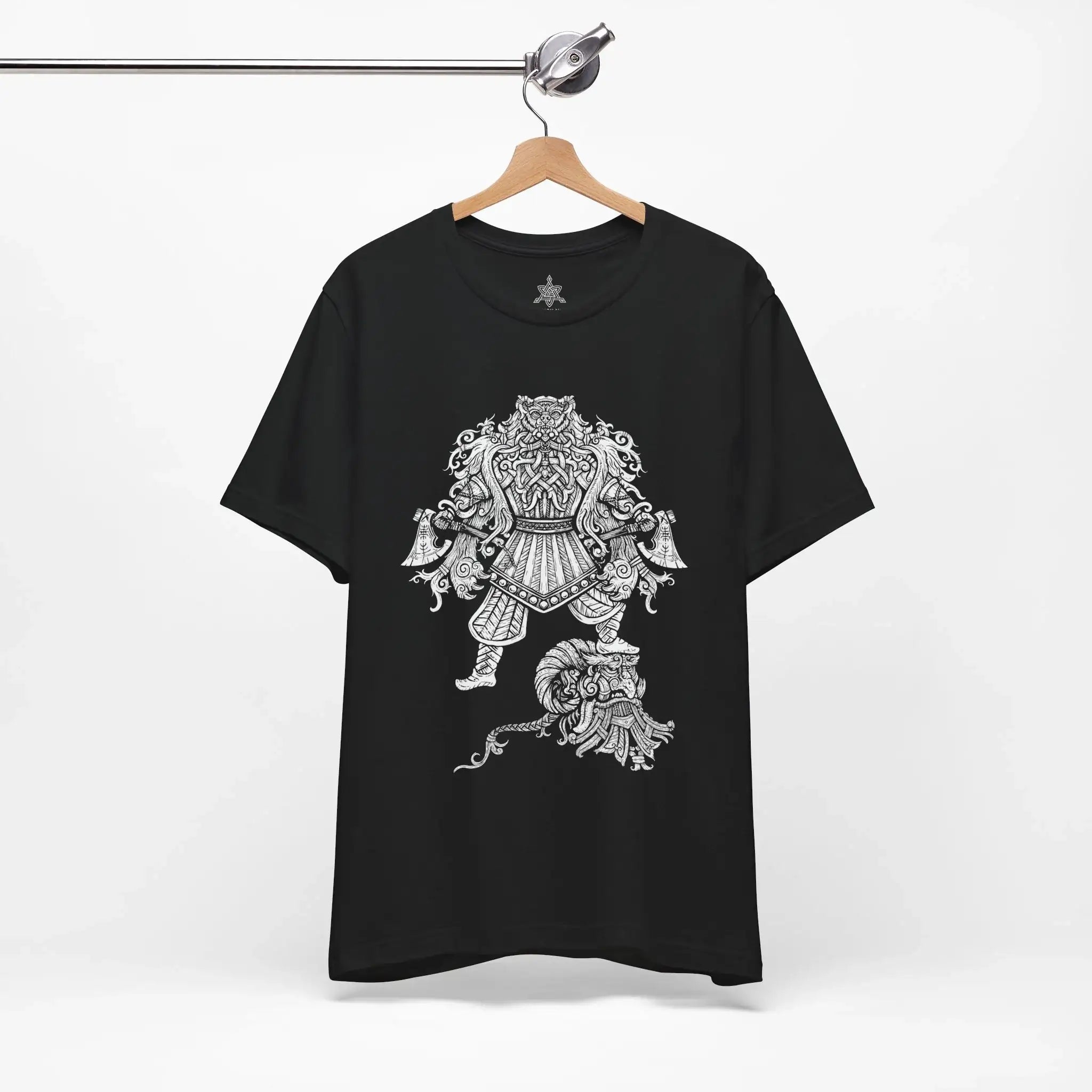 A black short-sleeve t-shirt hanging on a wooden hanger from a metal rail, featuring a large white graphic print of a detailed Viking Berserker on the front.