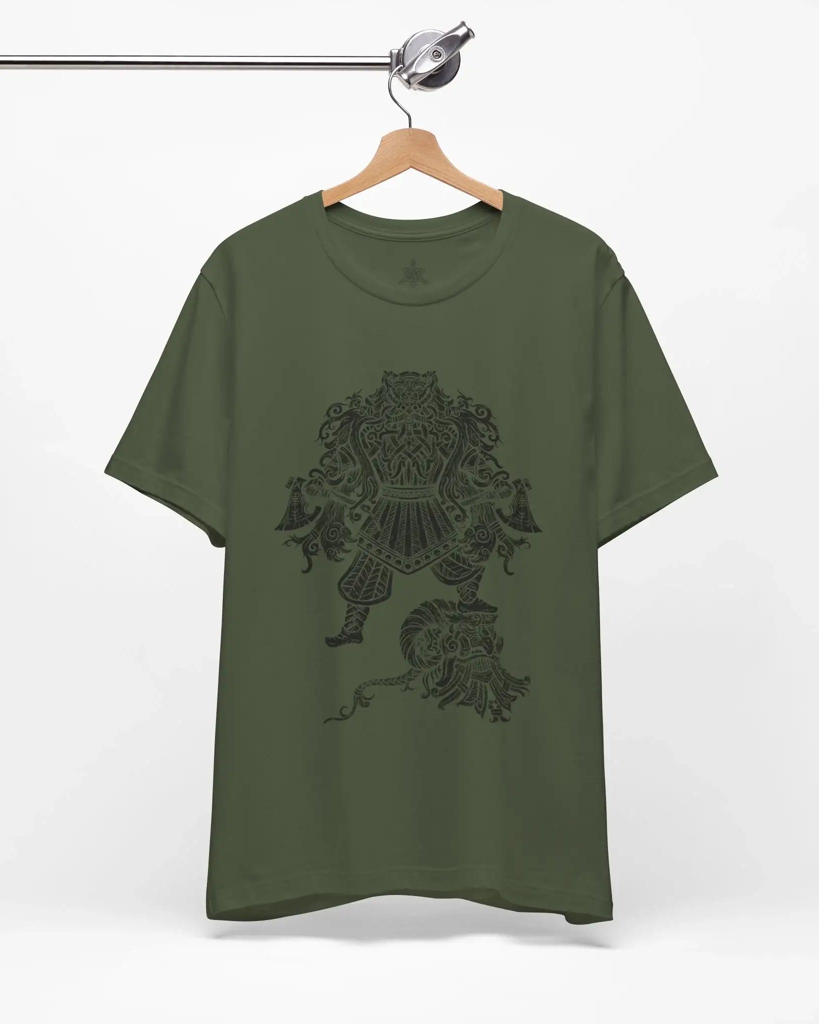 An olive green short-sleeve t-shirt hanging on a wooden hanger from a metal clothing rack, featuring a dark graphic print of a Viking Berserker on the front.