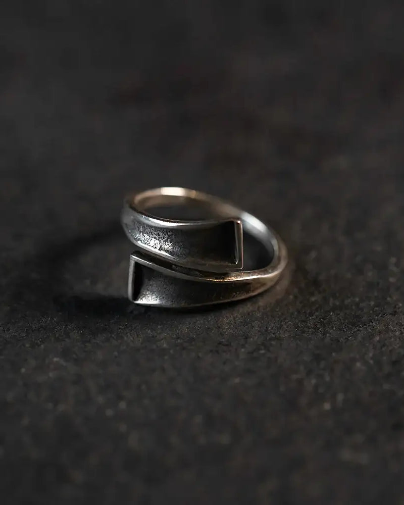 Handcrafted Norse-inspired silver ring with geometric design, textured finish, and Viking aesthetic