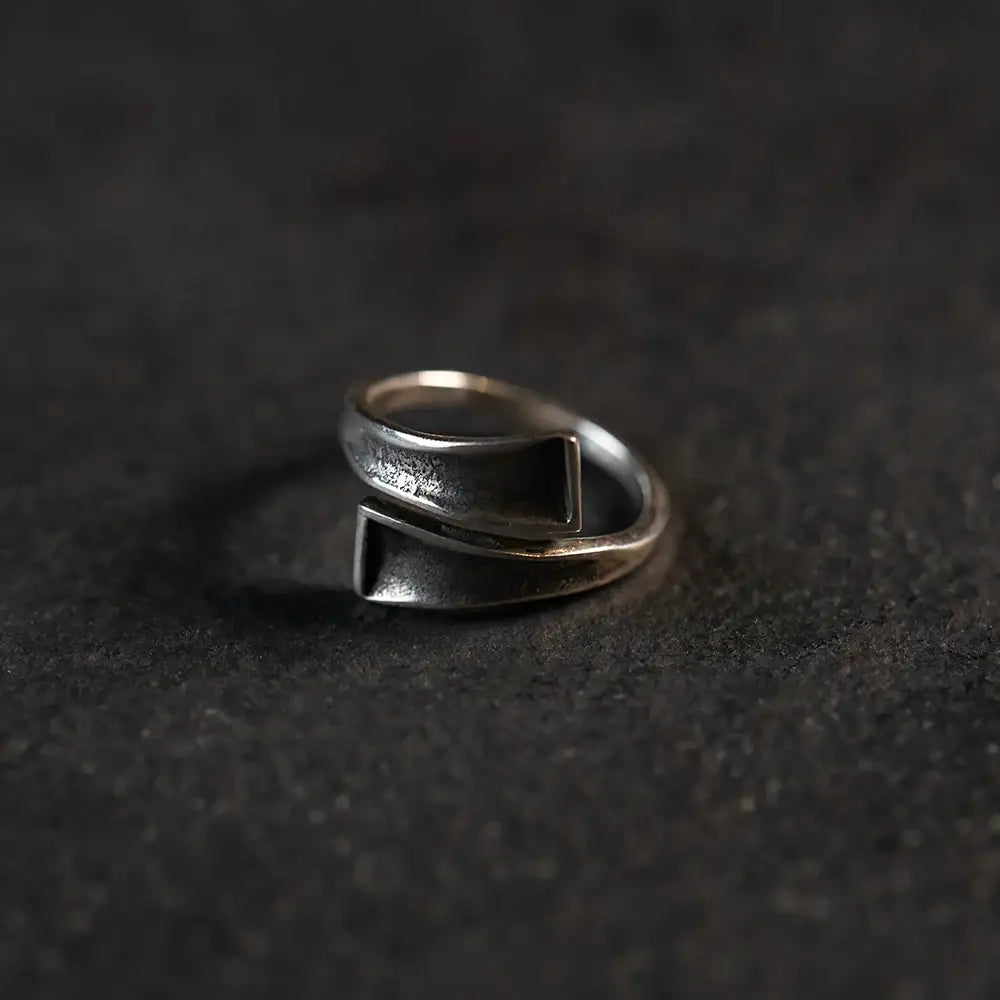 Handcrafted Norse-inspired silver ring with geometric design, textured finish, and Viking aesthetic