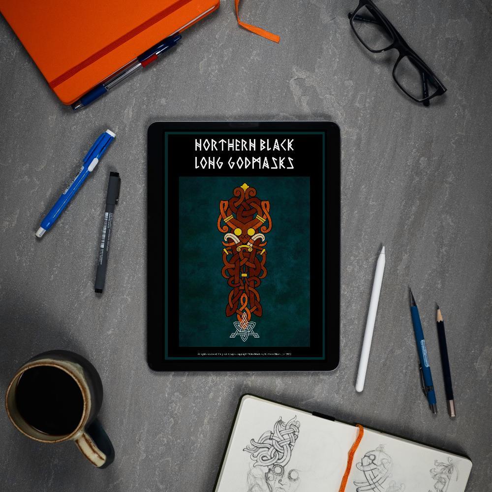 Northern Black Long Godmasks digital art book on tablet with Norse tattoo designs, sketchbook, pens, and coffee