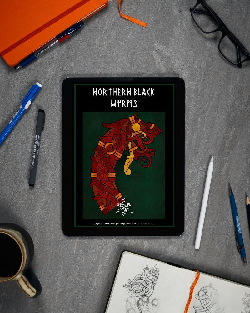 Northern Black Wyrm Viking tattoo design on tablet, surrounded by art tools and sketchbook