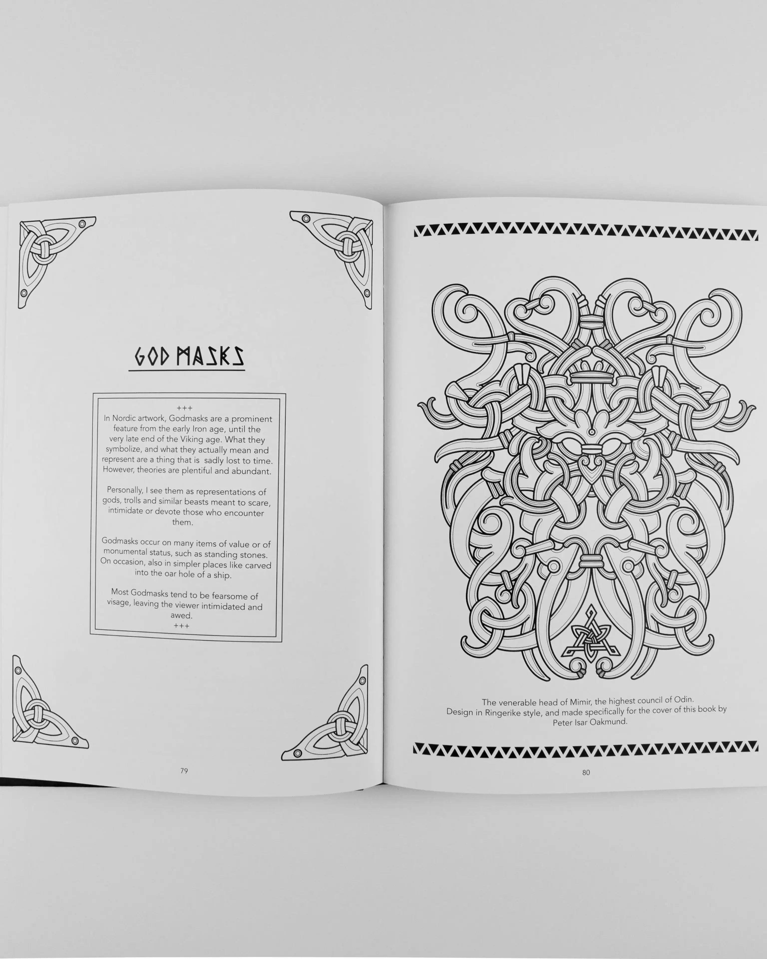 Viking-inspired God Masks art book page with intricate Norse knotwork design
