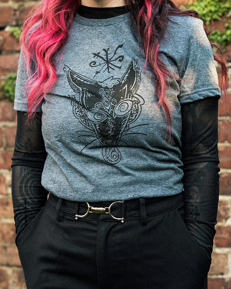 Grey t-shirt with Norse fox tattoo design, worn with black mesh sleeves against brick wall