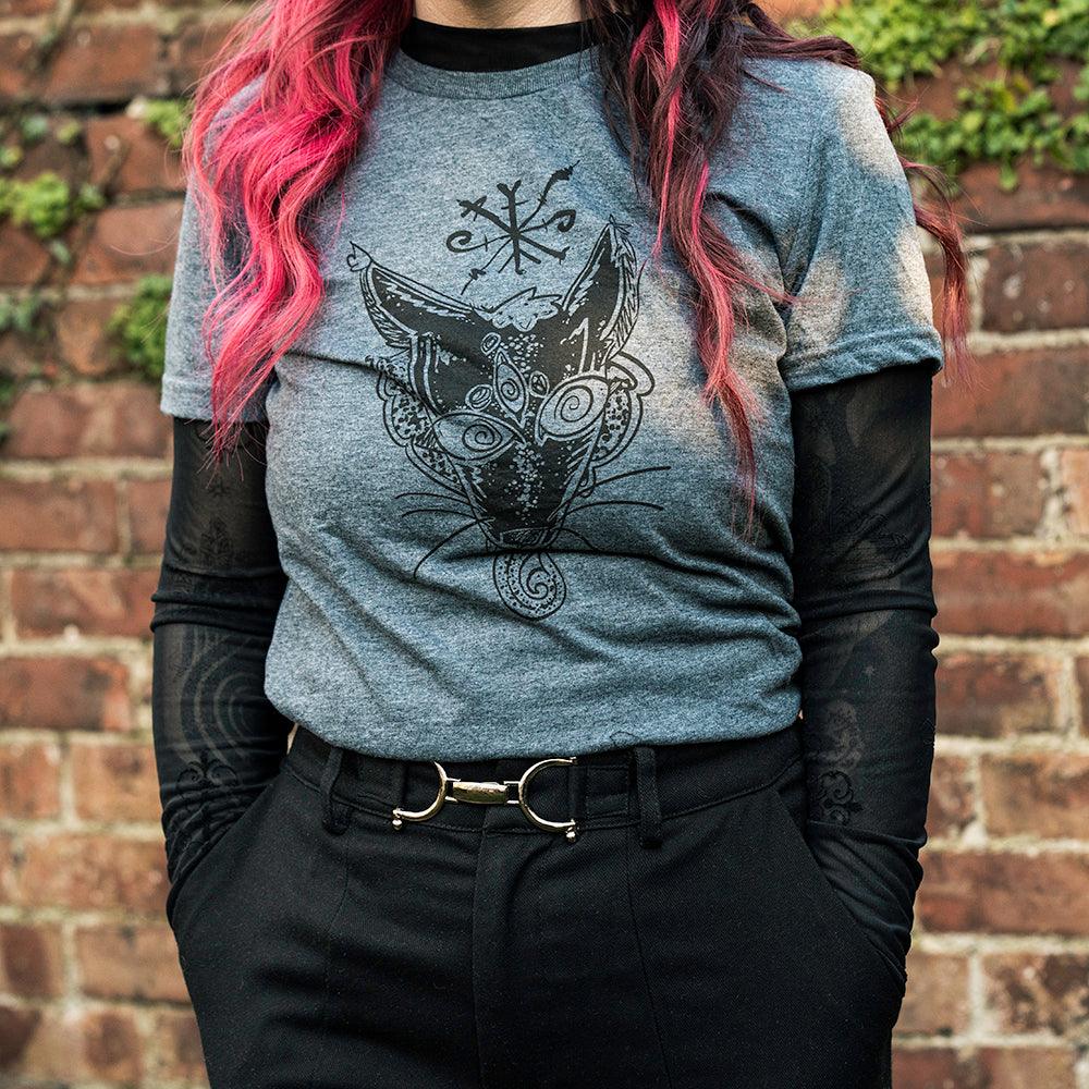 Grey t-shirt with Norse fox tattoo design, worn with black mesh sleeves against brick wall