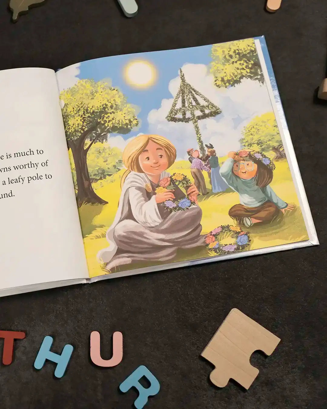 Children crafting flower wreaths under a sunny sky in a Norse-inspired illustrated book scene