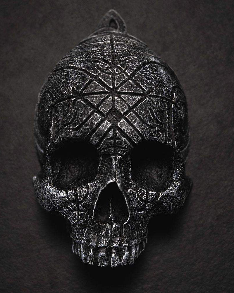 Dark Viking skull pendant with Norse rune carvings and textured metal finish