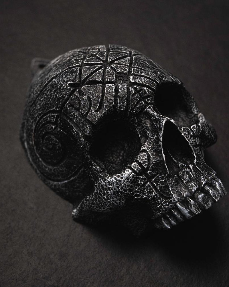Dark Norse skull pendant with intricate Viking knotwork and runic carvings, inspired by ancient artifacts.