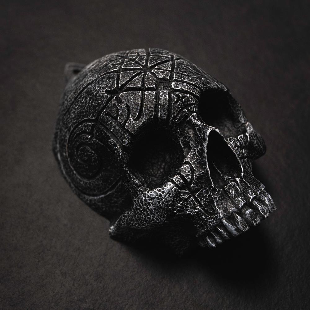 Dark Norse skull pendant with intricate Viking knotwork and runic carvings, inspired by ancient artifacts.
