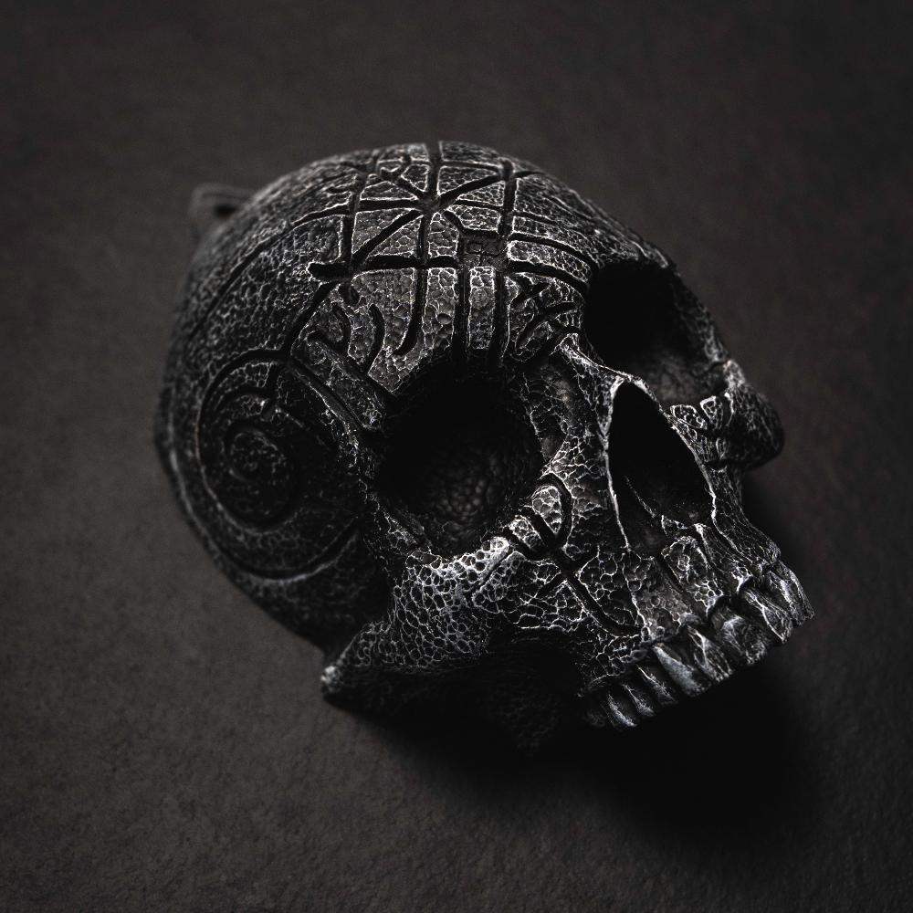 Dark Norse skull pendant with intricate Viking knotwork and runic carvings, inspired by ancient artifacts.