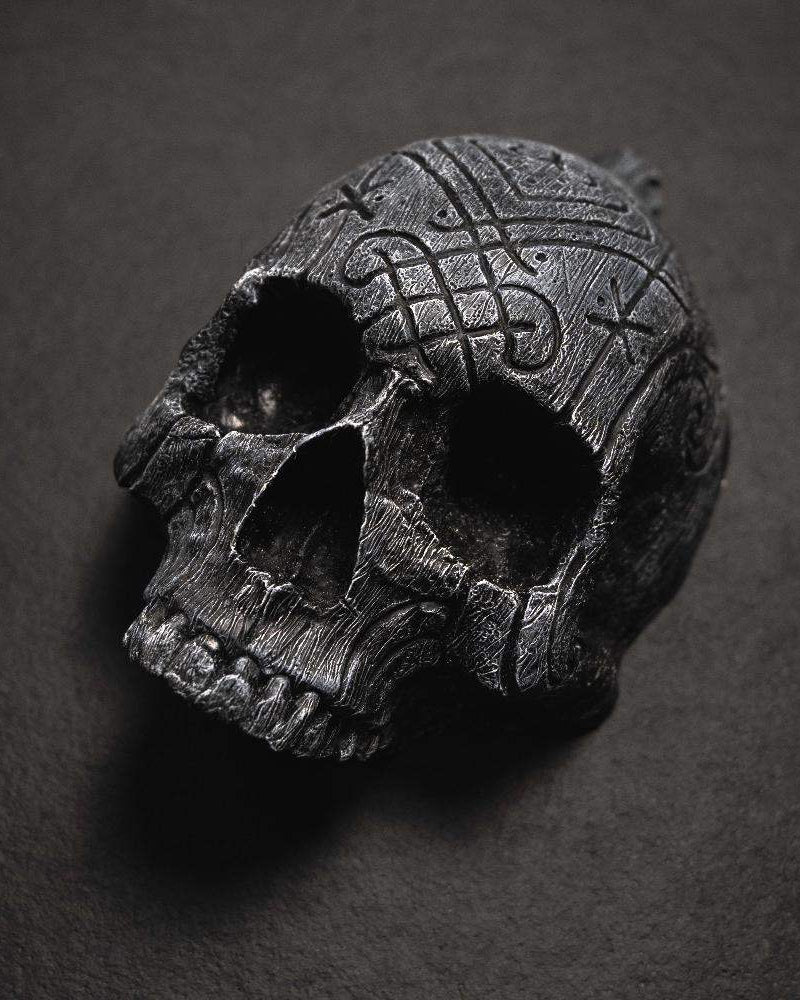 Dark skull pendant with Norse knotwork and runes, Viking-inspired jewelry design