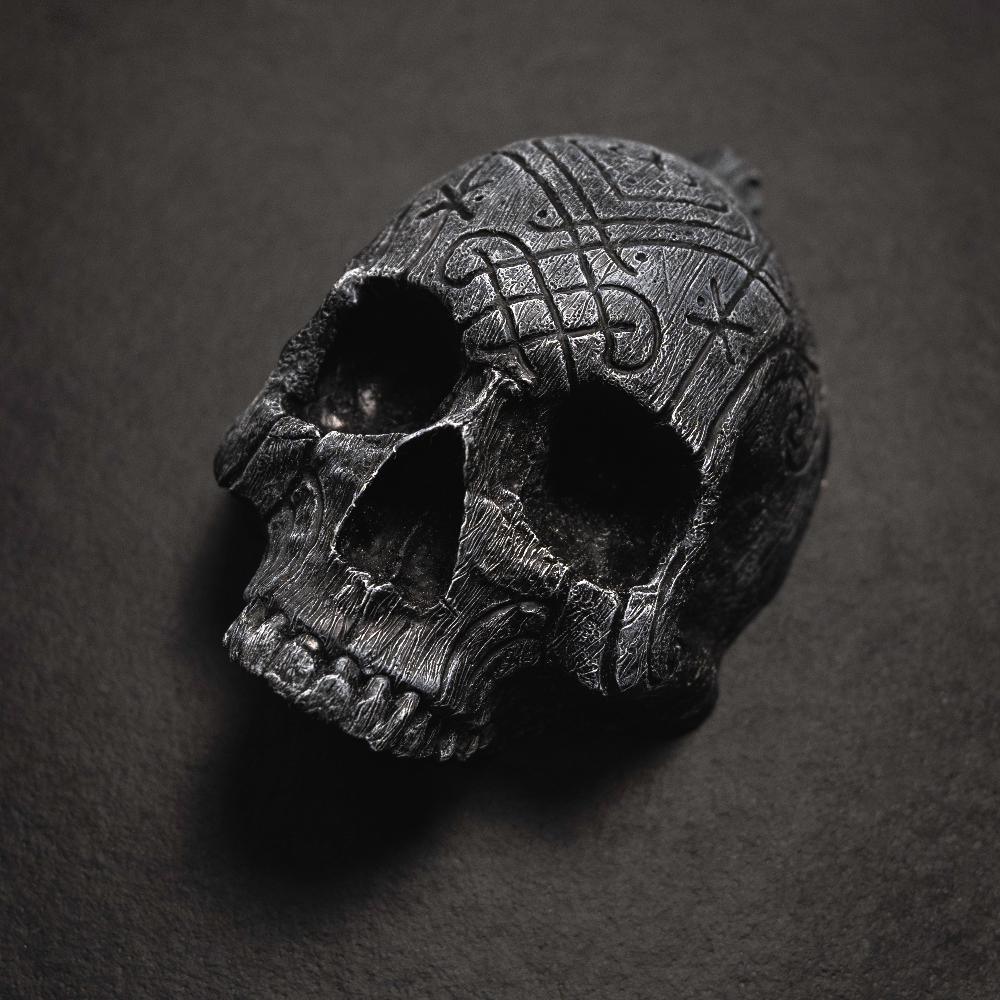 Dark skull pendant with Norse knotwork and runes, Viking-inspired jewelry design