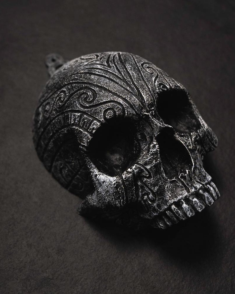 Dark Norse skull pendant with intricate Viking knotwork and runic carvings, inspired by ancient artifacts.