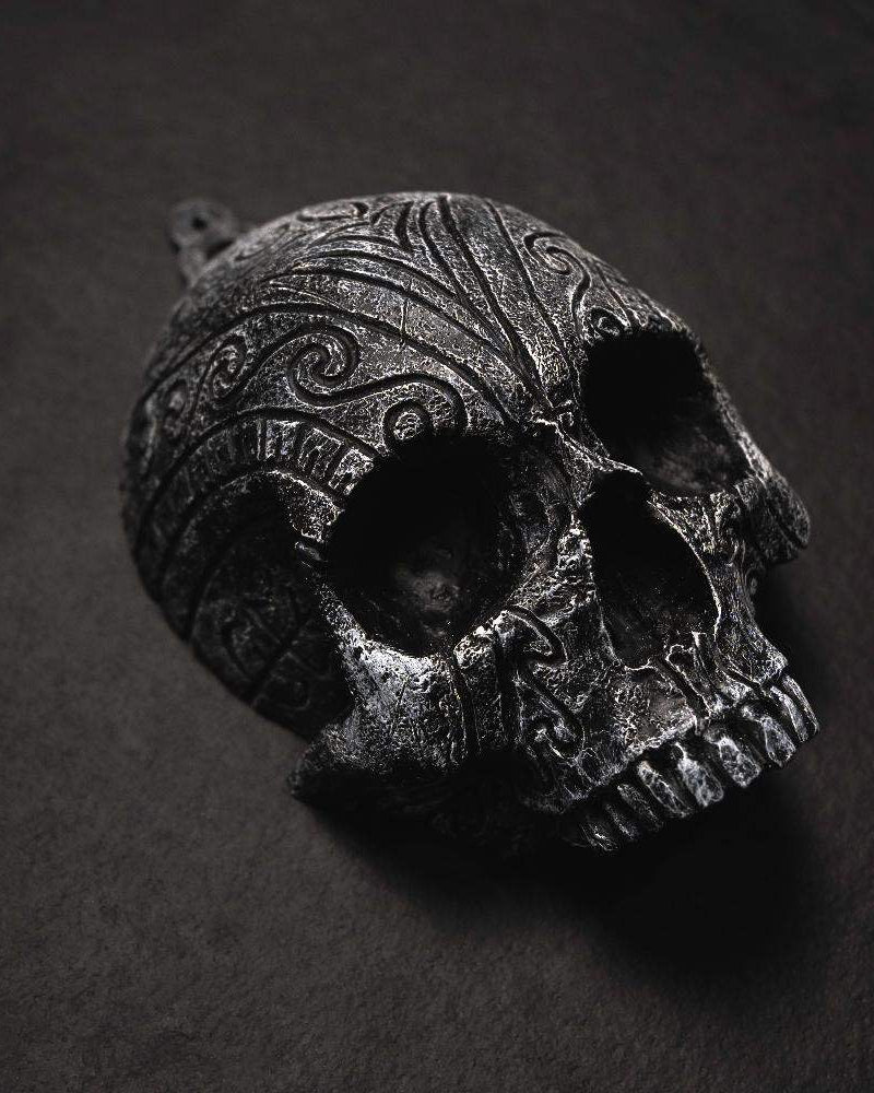 Dark Norse skull pendant with intricate Viking knotwork and runic carvings, inspired by ancient artifacts.