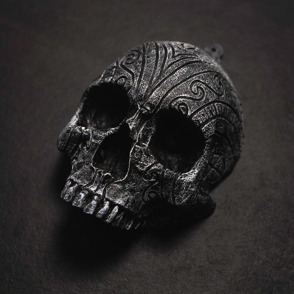 Dark Norse skull pendant with intricate Viking knotwork, inspired by authentic runes and artifacts