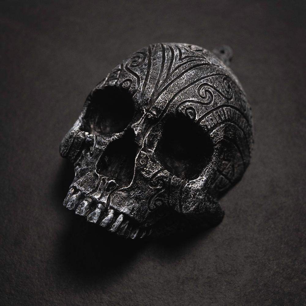 Dark Norse skull pendant with intricate Viking knotwork, inspired by authentic runes and artifacts
