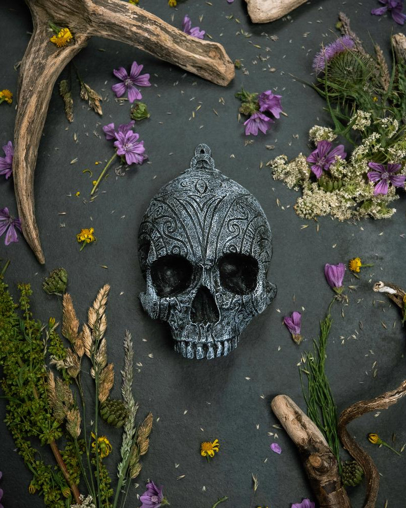 Resin human shaped skull engraved with bindrunes representing Lust.