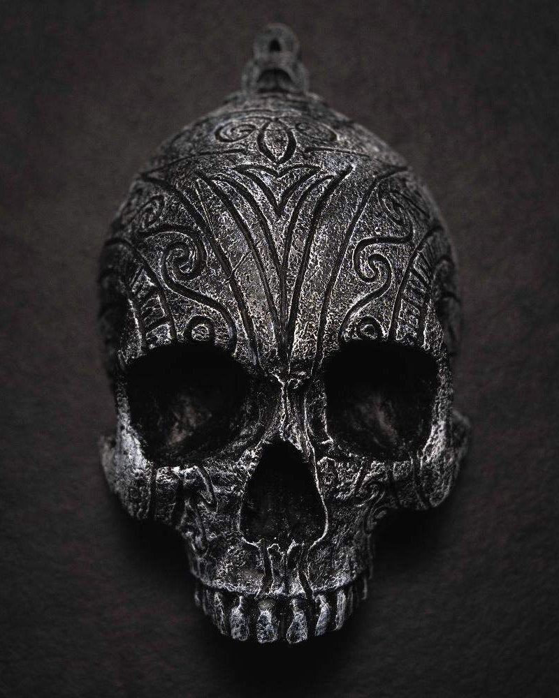Dark Norse skull pendant with intricate Viking knotwork and runic carvings, inspired by authentic artifacts.
