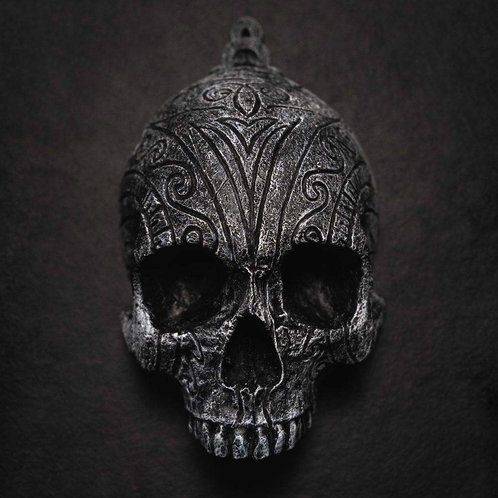 Dark Norse skull pendant with intricate Viking knotwork and runic carvings, inspired by authentic artifacts.