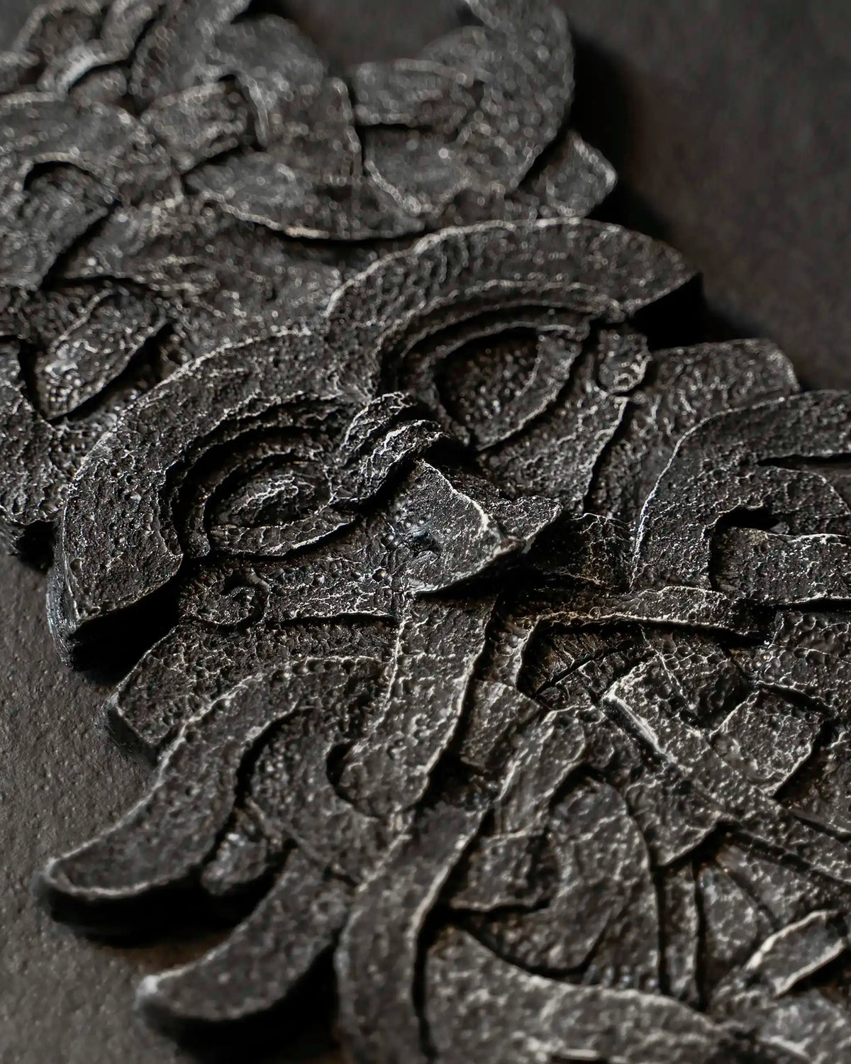 Intricate Norse-inspired resin sculpture with Viking knot patterns and textured finish
