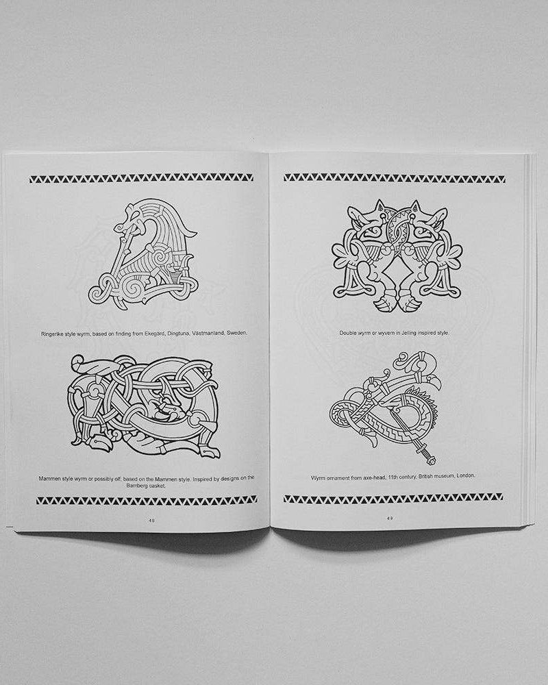 Viking tattoo designs book with Norse-inspired wyrms and runes, based on authentic archaeological artifacts
