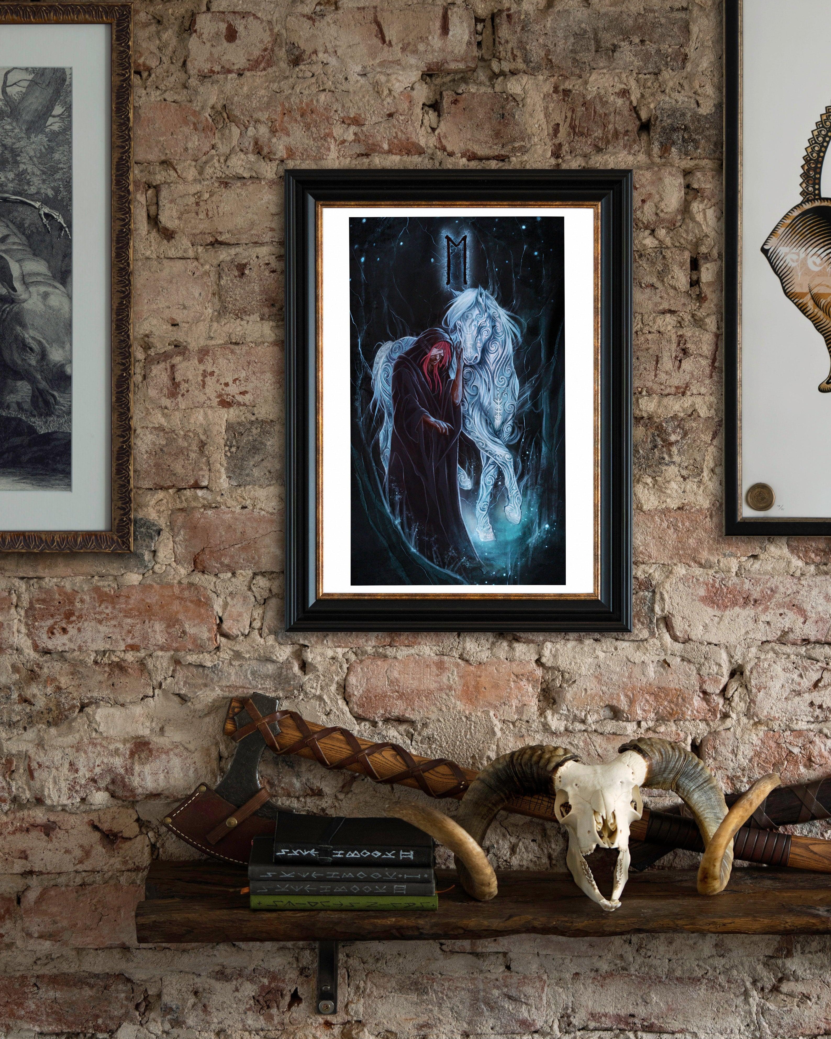 Framed Norse art print of Odin with Sleipnir, featuring runes and Viking symbolism, displayed on rustic brick wall.