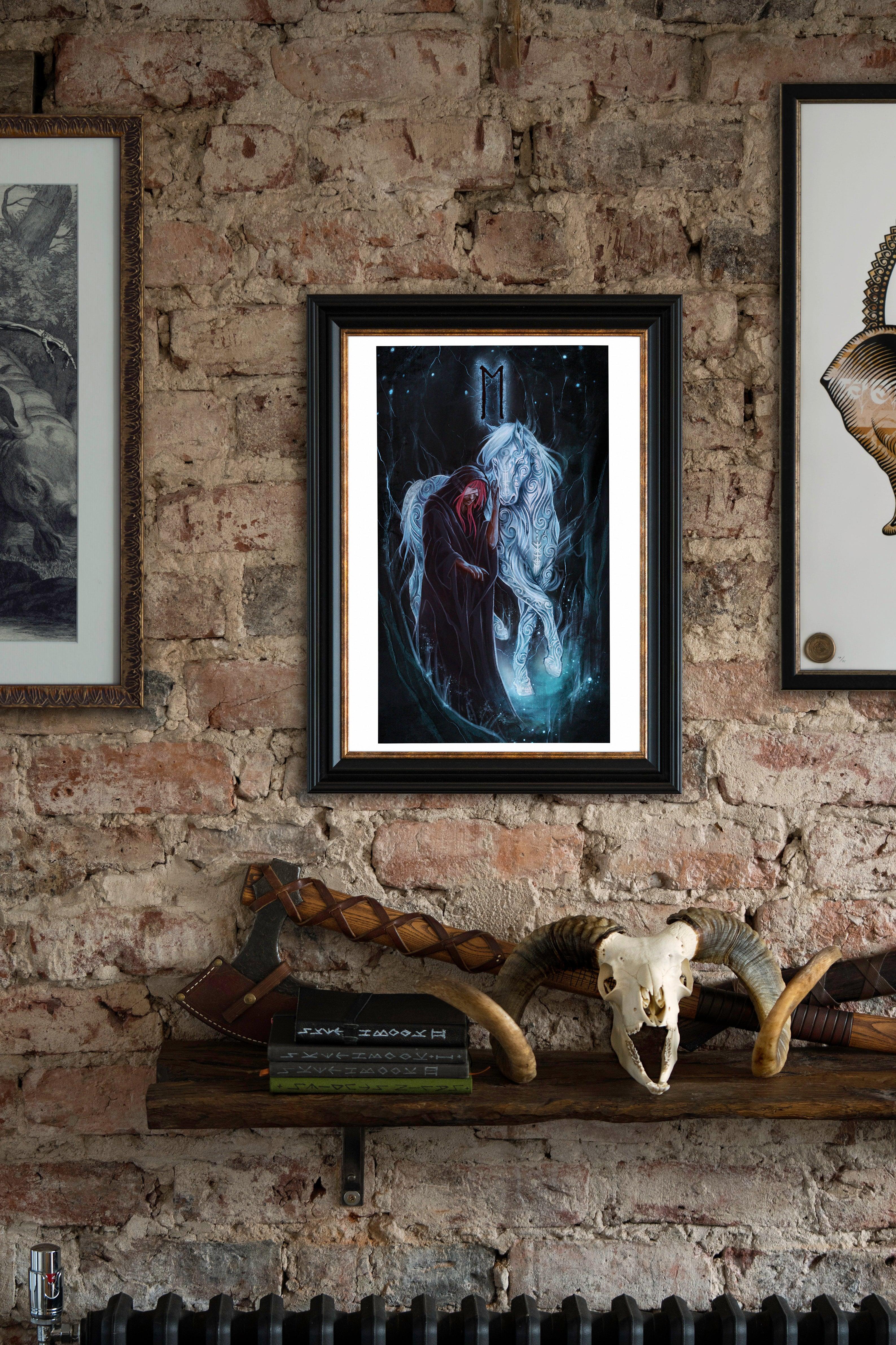 Framed Norse art print of Odin with Sleipnir, featuring runes and Viking symbolism, displayed on rustic brick wall.