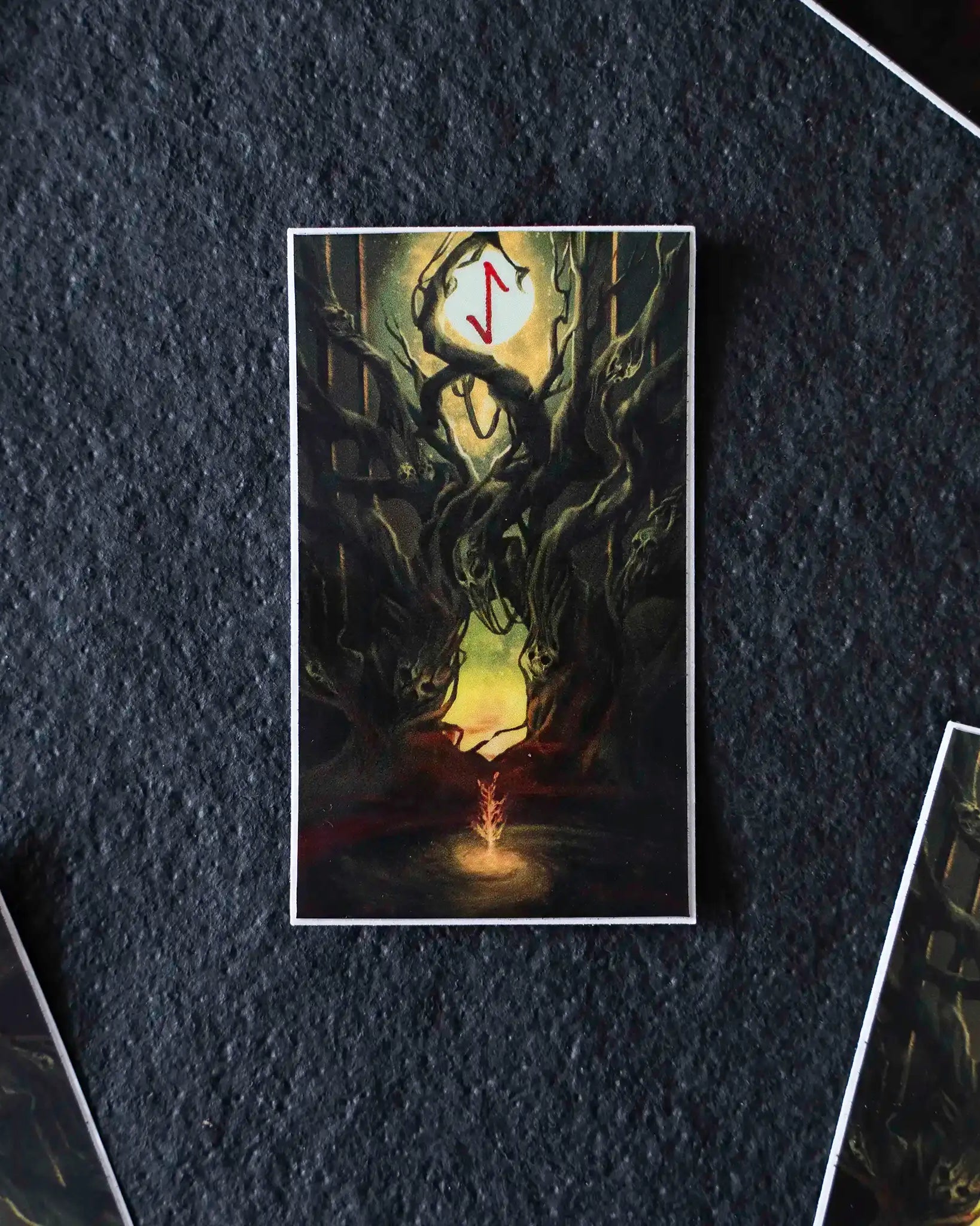 Norse-inspired art card with twisted tree, glowing moon, and red rune symbol, evoking Viking mythology