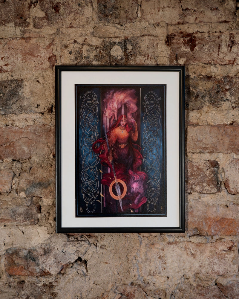 Freya, norse god holding a spear and walking towards the viewer. She is surrounded by two cat like creatures. on both sides of the print there are nordic designs.