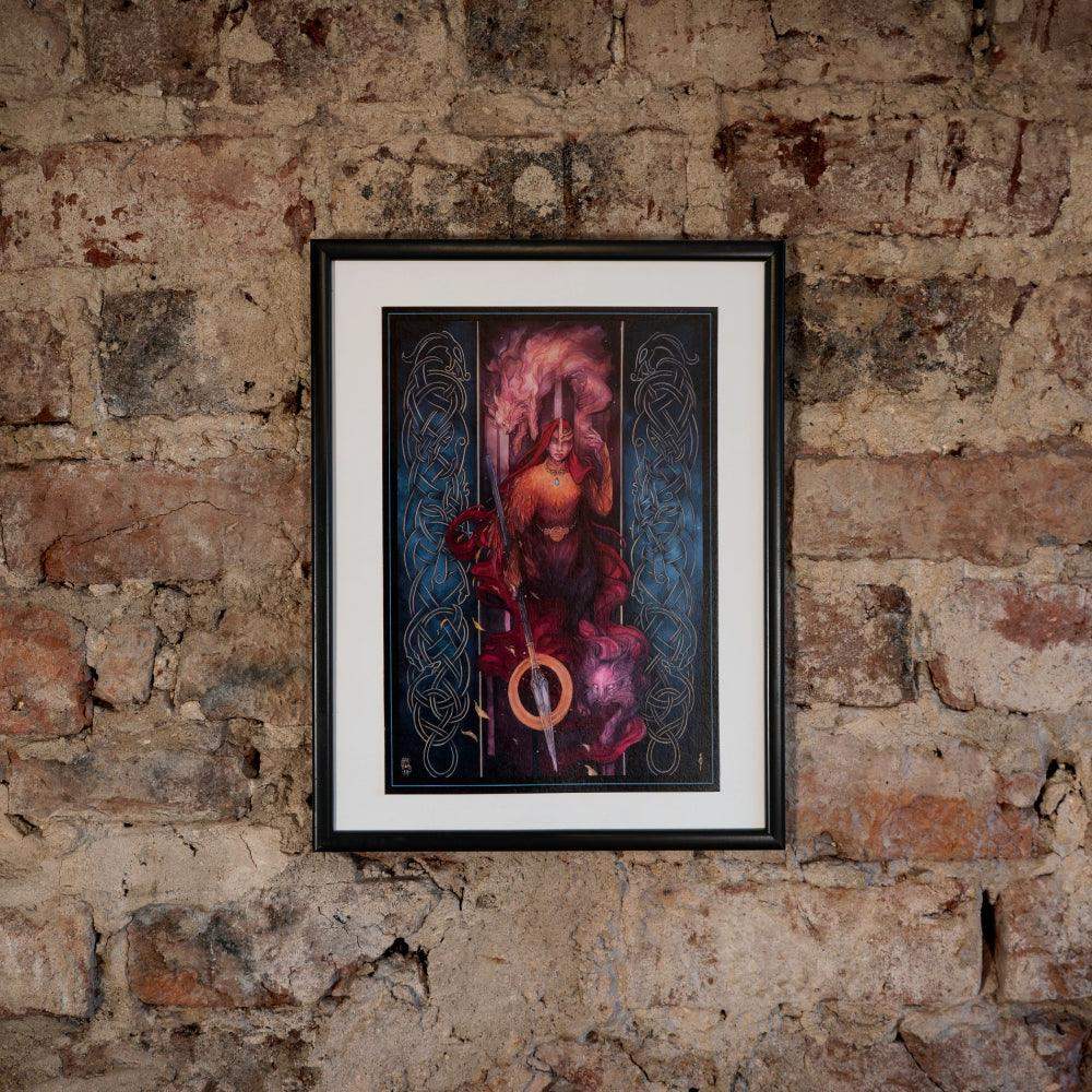 Framed Norse art print of Viking warrior with sword, Celtic knots, and fiery aura on rustic brick wall
