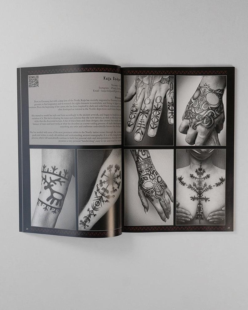 Viking tattoo art book featuring Norse-inspired designs on hands, arms, and chest with runic patterns