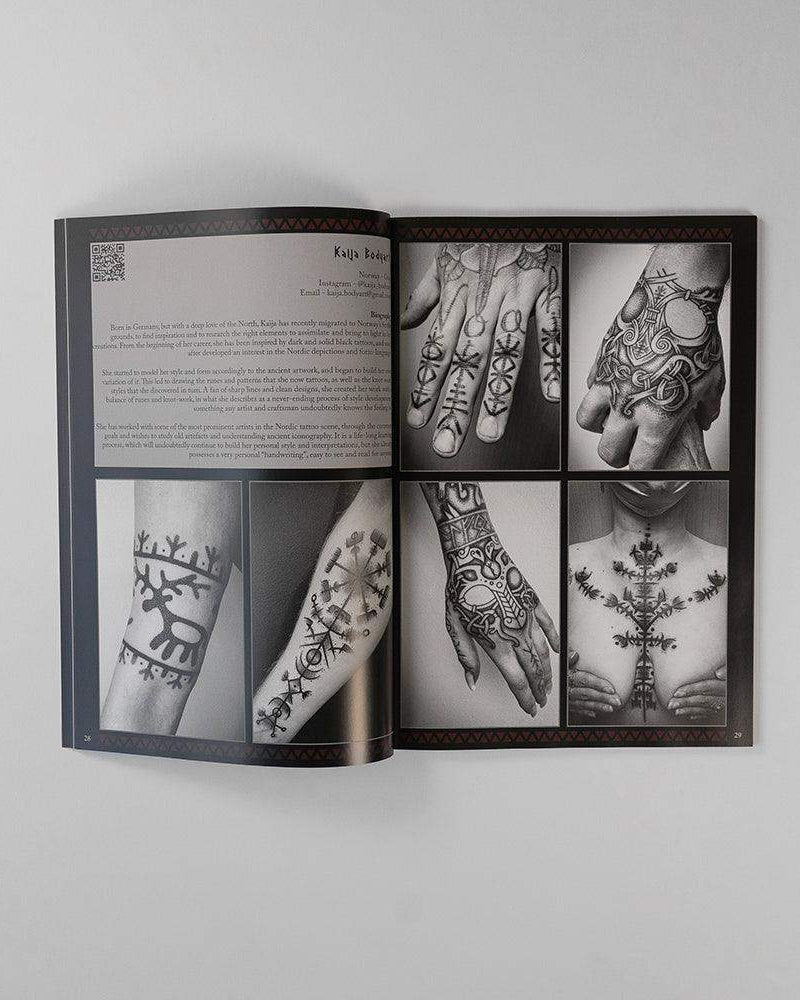 Viking tattoo art book featuring Norse-inspired designs on hands, arms, and chest with runic patterns