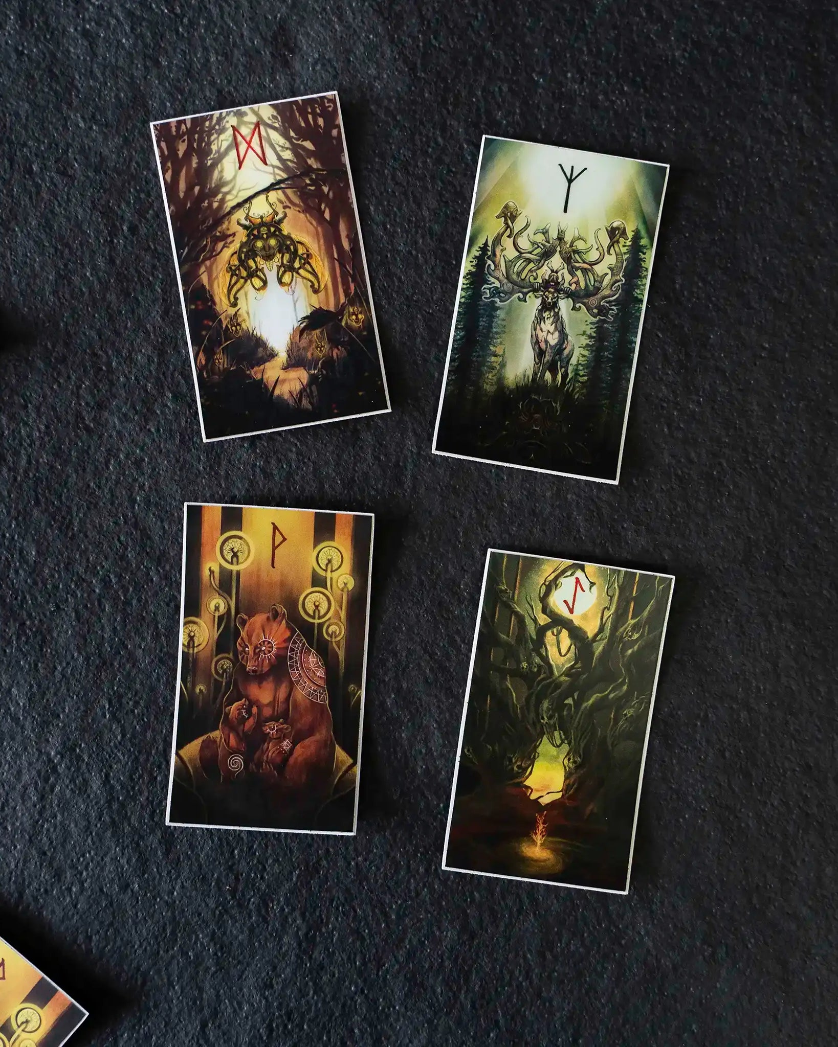Norse rune cards with Viking art, featuring forest creatures and ancient symbols on dark background