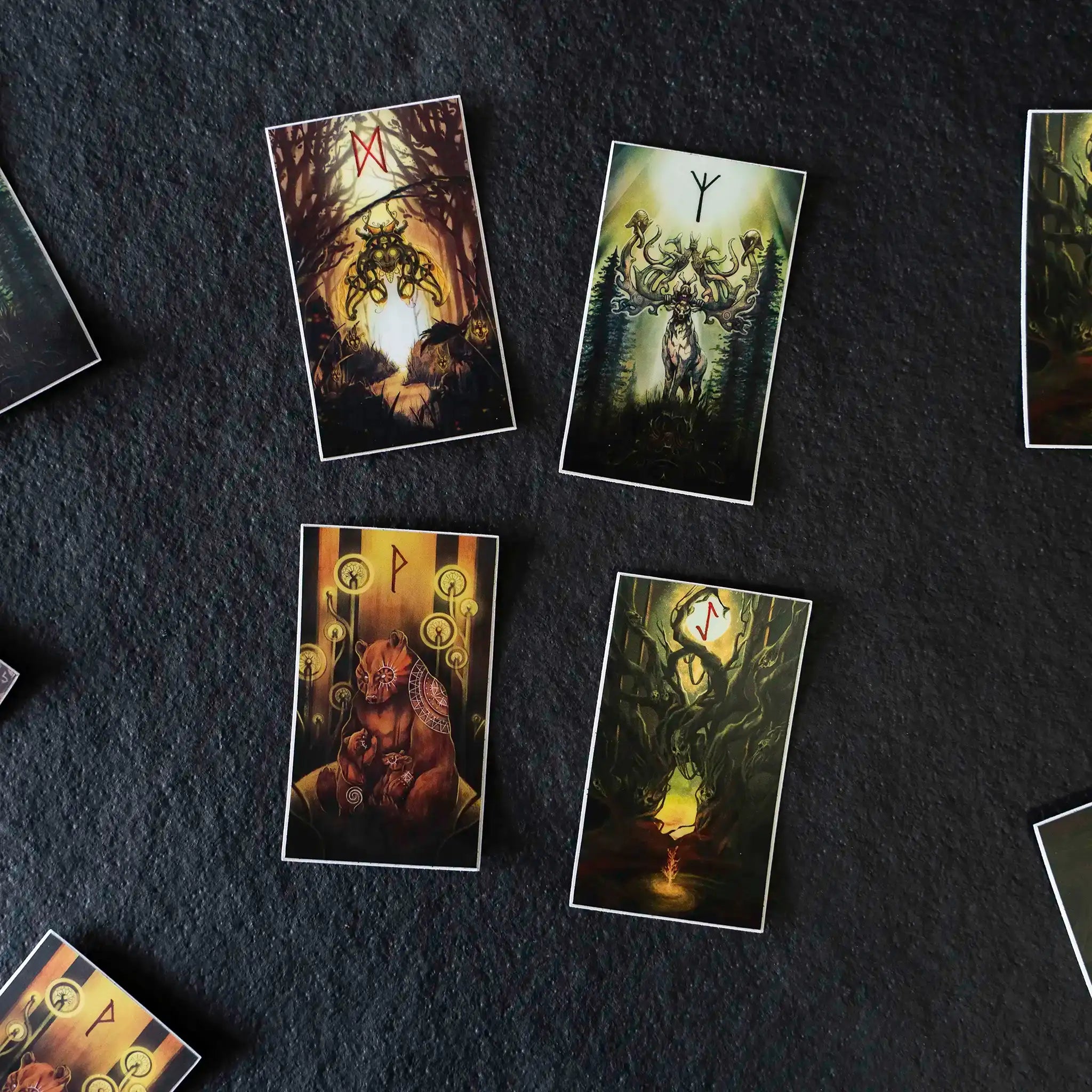 Norse rune cards with Viking art, featuring forest creatures and ancient symbols on dark background