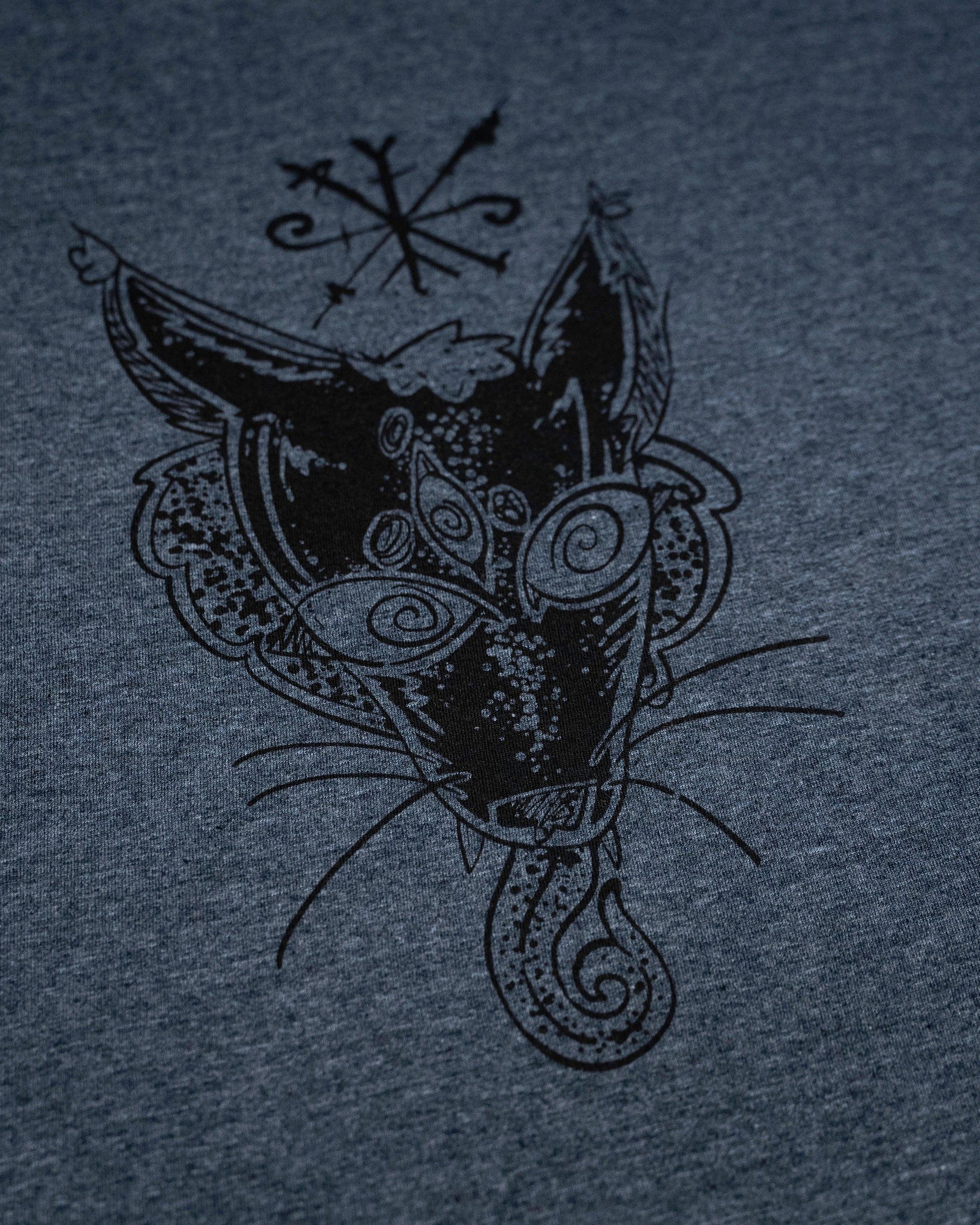 Norse-inspired cat head with Viking runes and tribal patterns on dark heather gray apparel