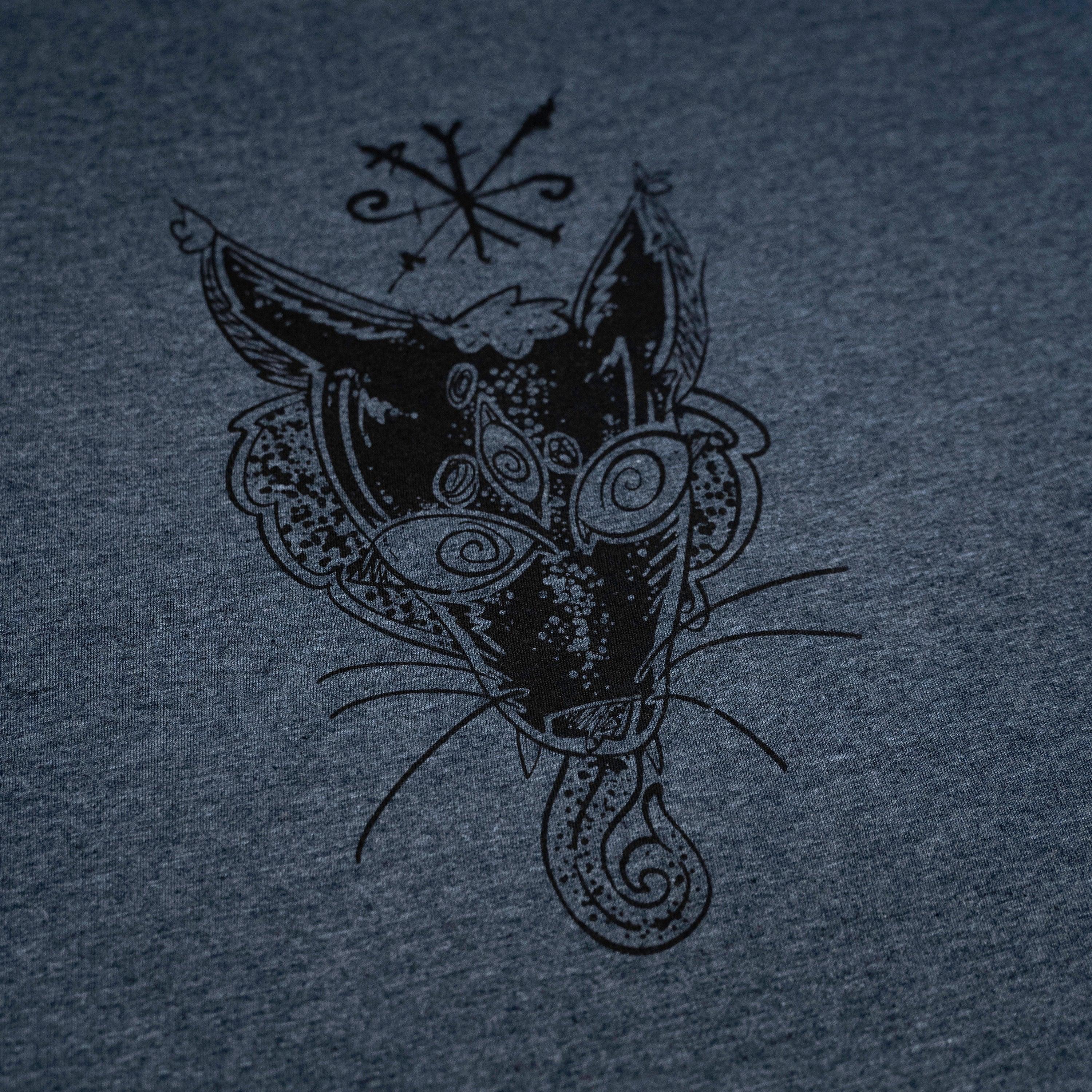 Norse-inspired cat head with Viking runes and tribal patterns on dark heather gray apparel