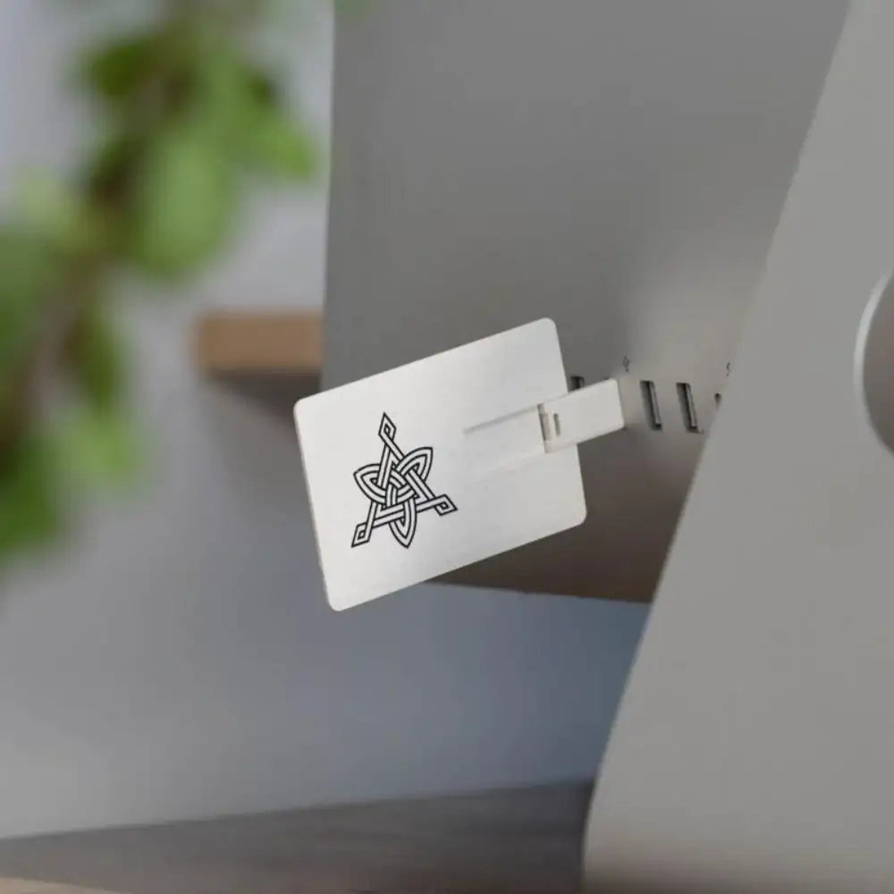 Norse-inspired USB drive with Viking knotwork design plugged into computer