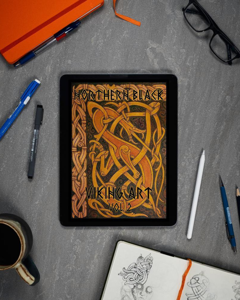 Northern Black Viking Art Vol 2 digital book on tablet with sketchbook, pens, and coffee — Norse tattoo designs
