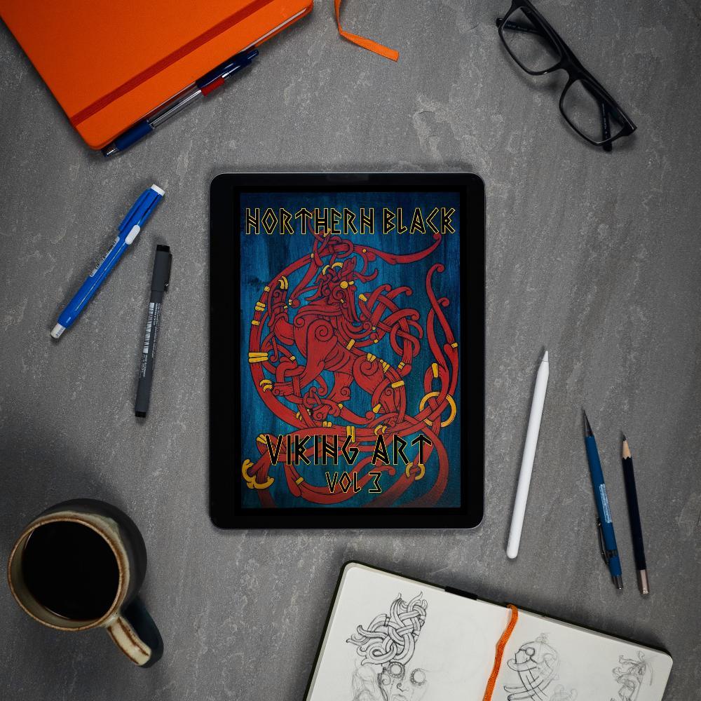 Northern Black Viking Art Vol 3 digital book on tablet with sketchbook, pens, and coffee — Norse tattoo designs