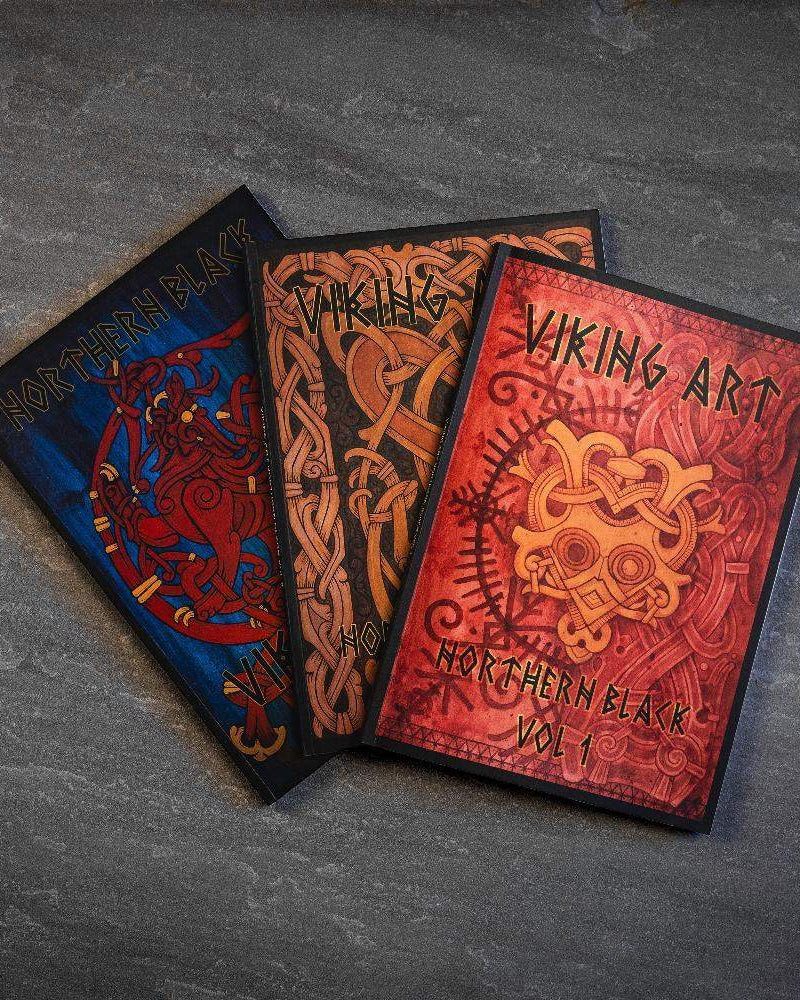 Viking art books with Norse designs, featuring Northern Black Vol 1 and intricate knotwork patterns.