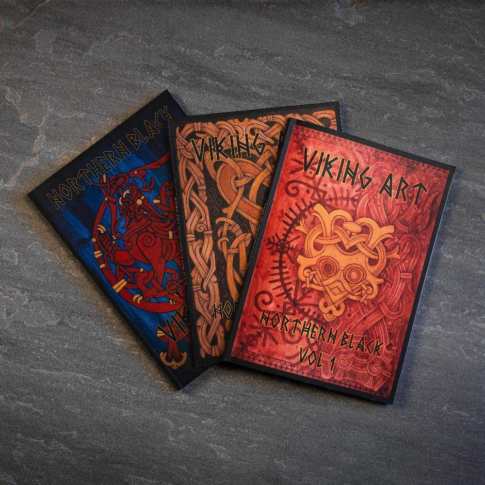 Viking art books with Norse designs, featuring Northern Black Vol 1 and intricate knotwork patterns.