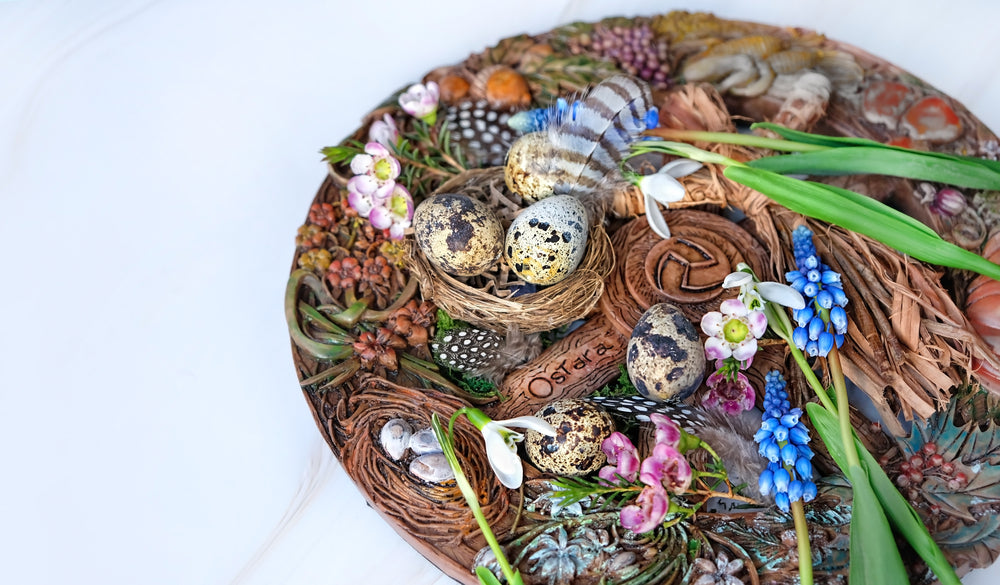 Decorative Ostara altar with nest, eggs, flowers, and feathers