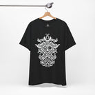 A black short-sleeve t-shirt hanging on a wooden hanger from a metal rack, featuring a large white Norse knotwork design printed on the front.