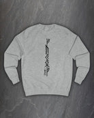 Front of a heather grey F*ck Off Bindrune sweatshirt with a tall black vertical bind rune print on a dark slate background