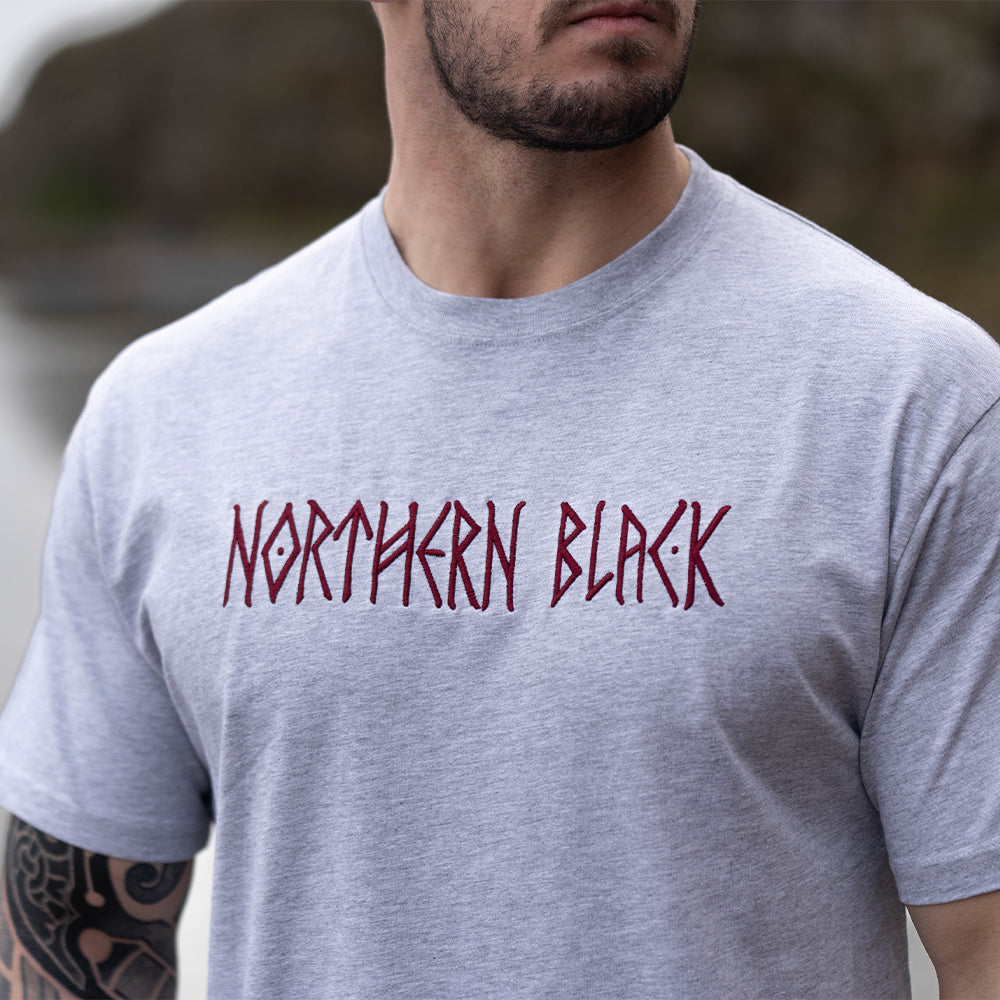 grey tee shirt with a northern black logo on it