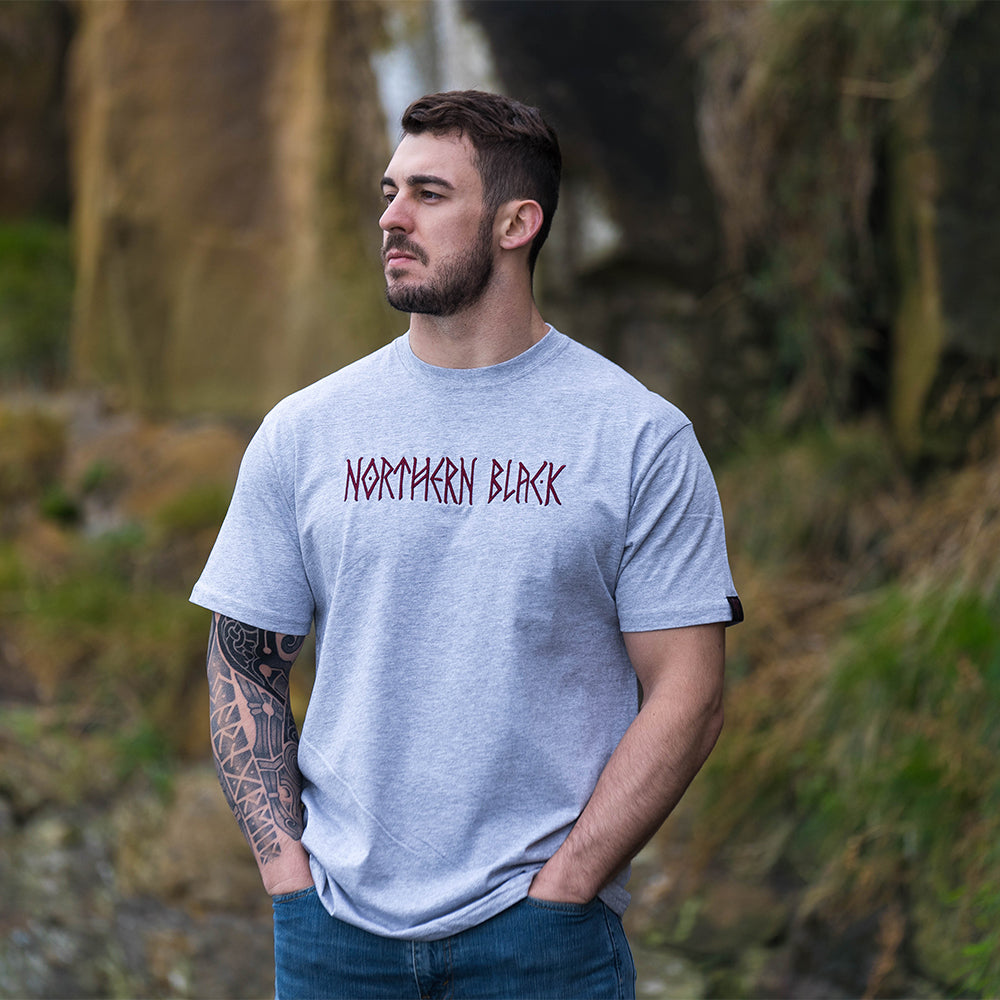 grey tee shirt with a northern black logo on it