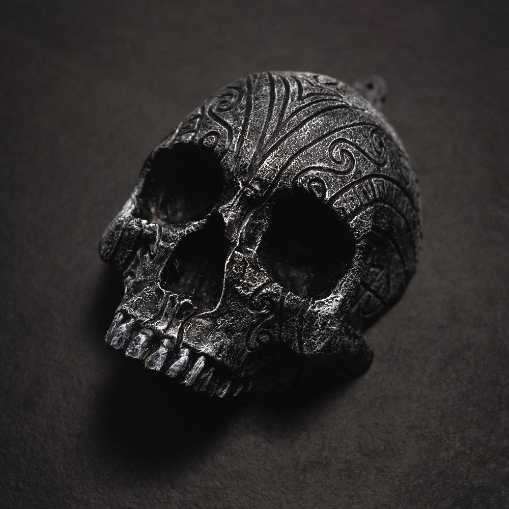 Resin human shaped skull engraved with bindrunes representing Lust.