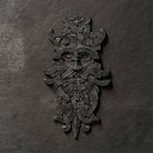 Viking-inspired Norse art resin sculpture with intricate knotwork and mythical face design